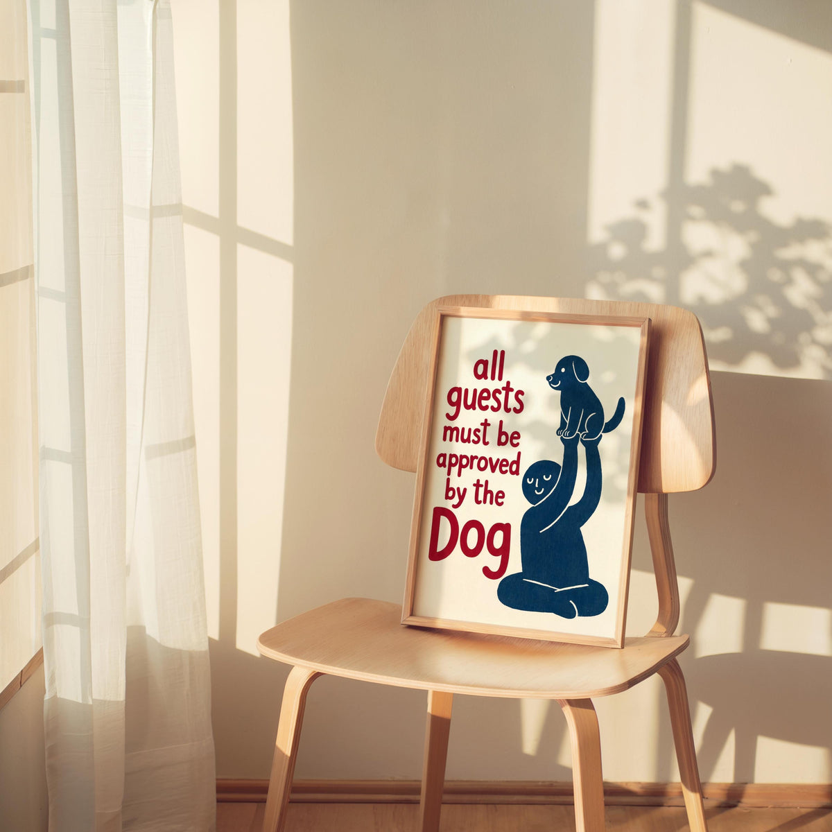 Red-accent dog poster leaning on a chair, strong side light and cozy room styling, funny pet wall art gift idea