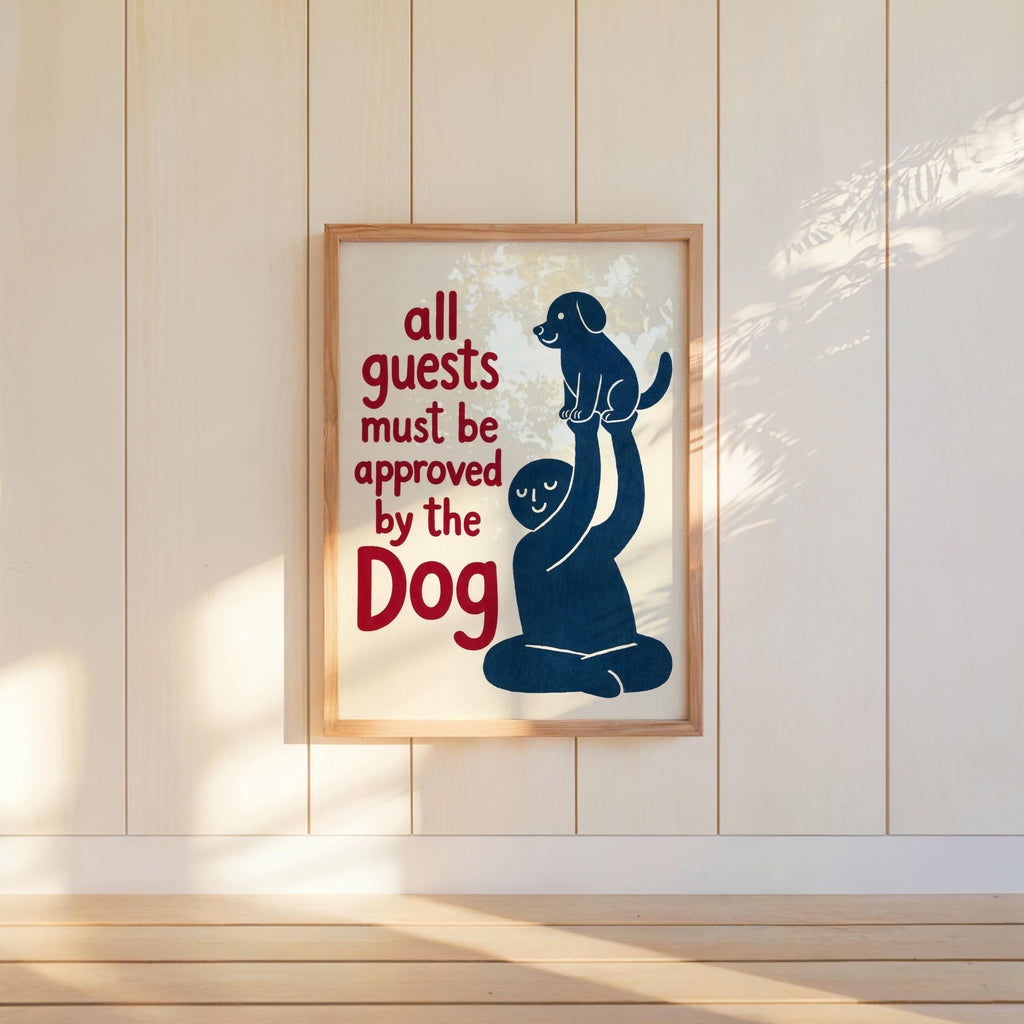Blue dog print hung in a tall frame on painted shiplap, warm light and floor shadow, dog house rules sign vibe
