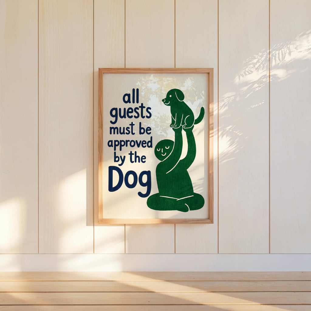 Green dog illustration framed and hung low on a sunlit wall, expressive typography, humorous dog print for dog owners