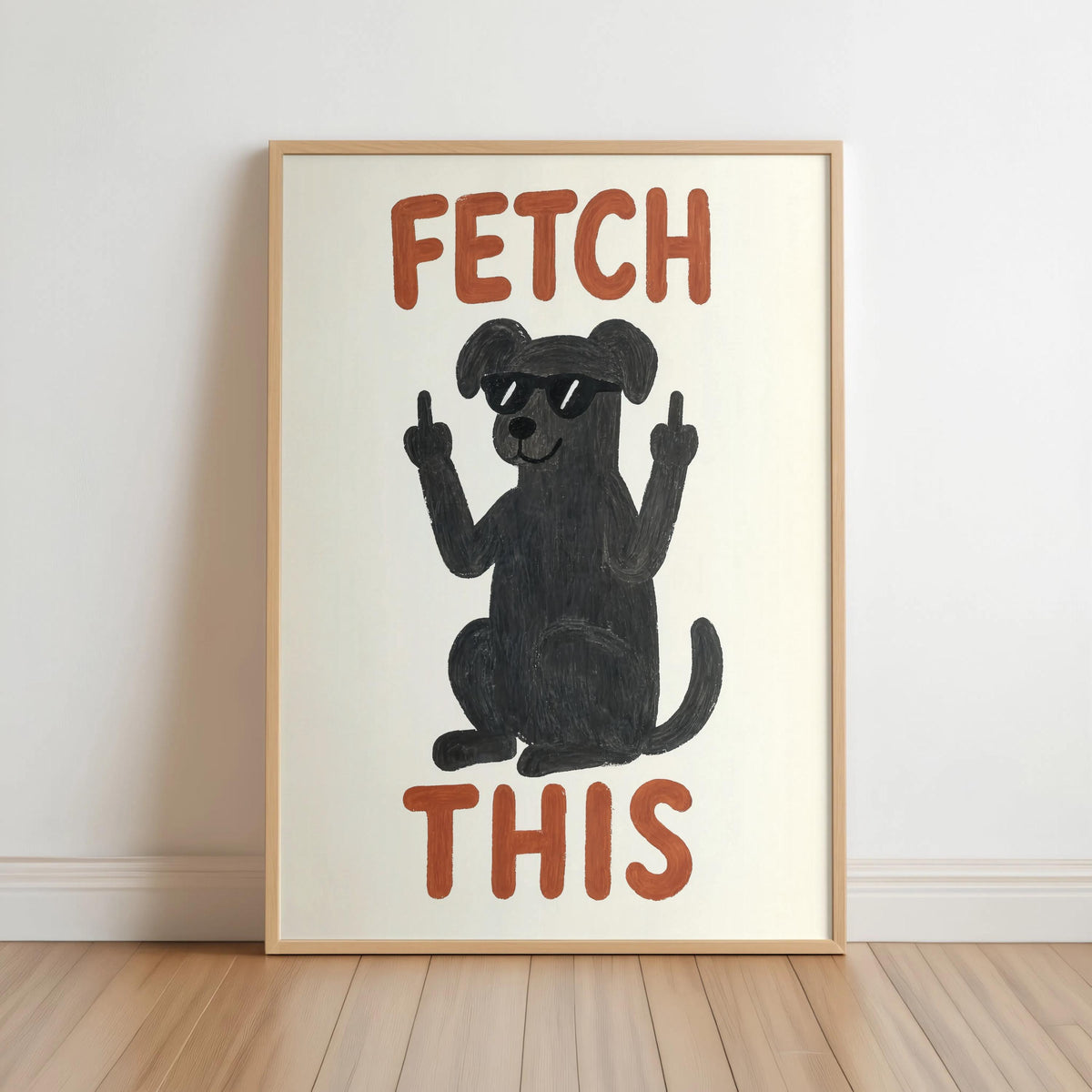 Unframed print leaning on skirting, charcoal dog silhouette, rust orange FETCH THIS lettering, sarcastic dog wall art