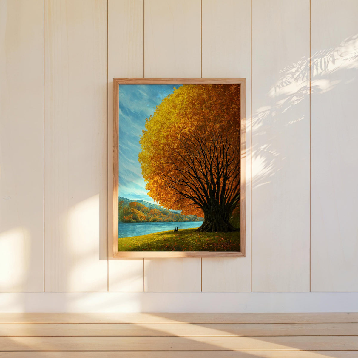 Autumn tree lake wall art hung on white vertical panels, cozy cottage wall art vibe, glowing golden foliage over blue water