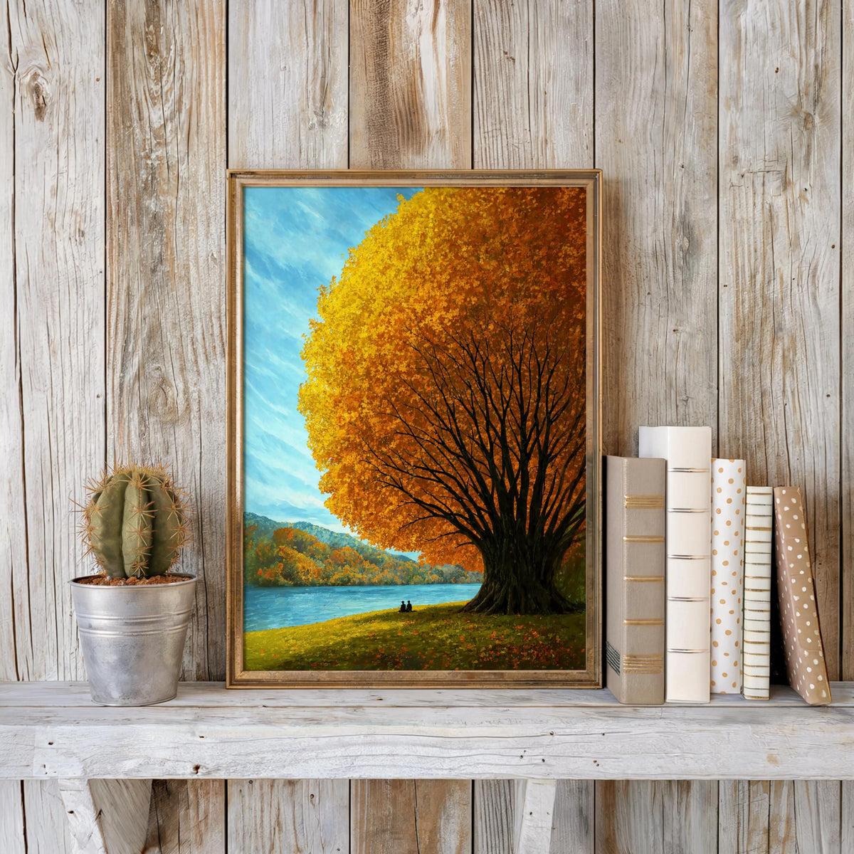 Autumn tree lake wall art styled on reclaimed wood backdrop with books and a plant, rustic cabin wall decor look