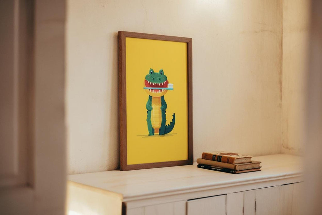 Wood-framed crocodile print resting on white cabinet beside books, whimsical alligator art print, kids dental wall art
