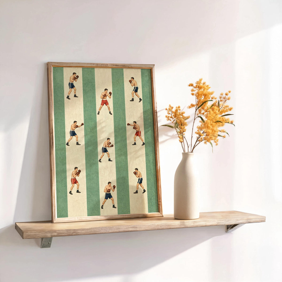 Green-striped vintage boxer poster on a wooden shelf, framed, evokes boxing gym decor with tiny illustrated fighters
