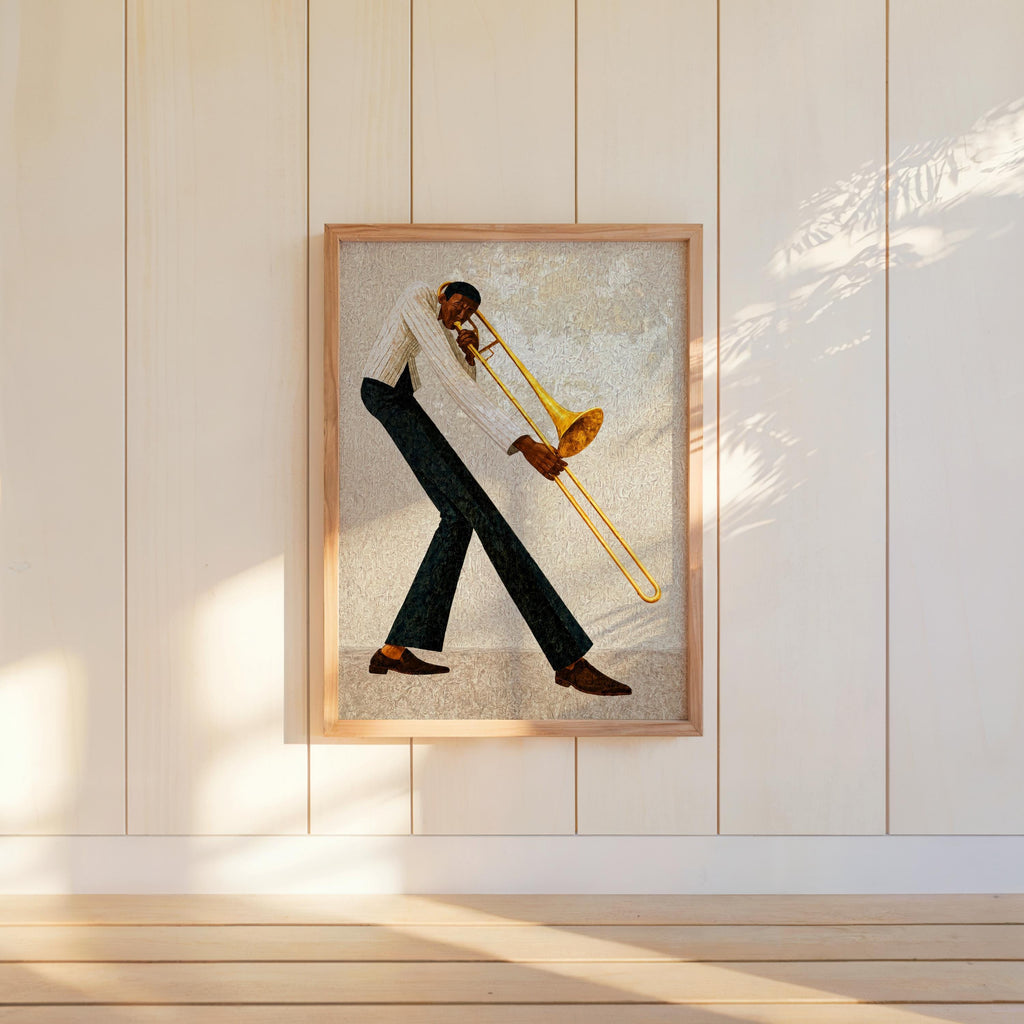 Jazz trombone wall art, light neutral framed on paneled wall, Afrocentric black musician artwork display.