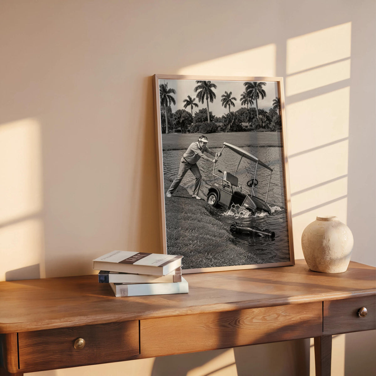 Angry golfer poster on sunlit wooden desk mockup, vintage golf cart tipping into lake, monochrome.