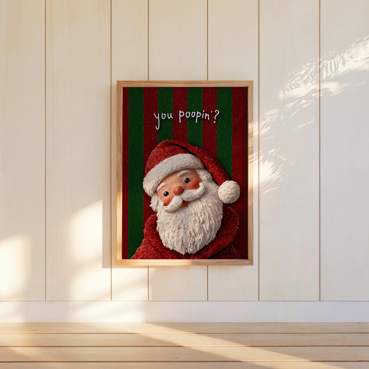Portrait with bold red and green stripes, Santa slightly tilted and smiling, mounted lower on wall, playful funny Santa wall art and funny Christmas bathroom sign.
