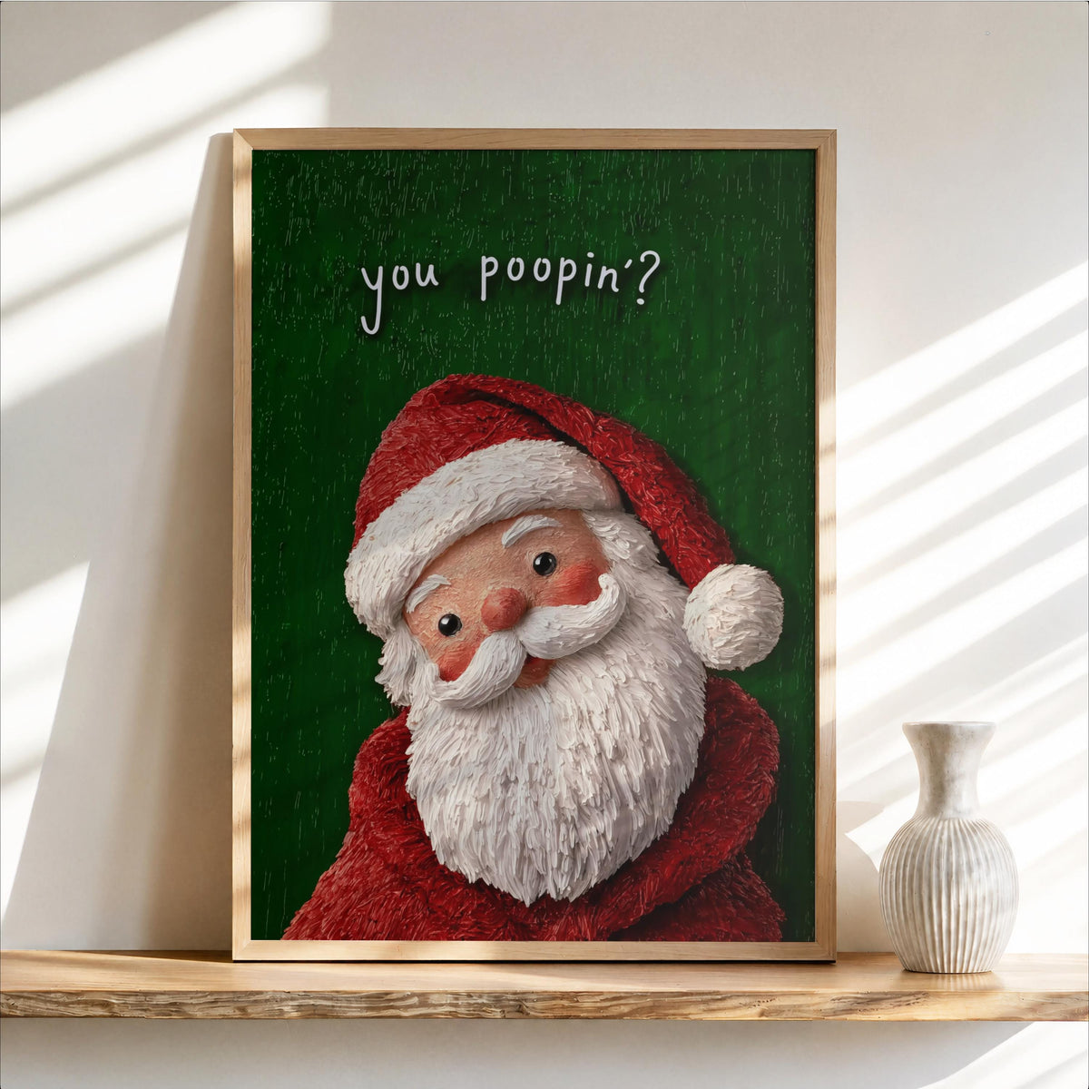 Green background close-up of nostalgic Santa face in a frame on a shelf, playful type, Christmas toilet sign and funny Christmas bathroom sign.