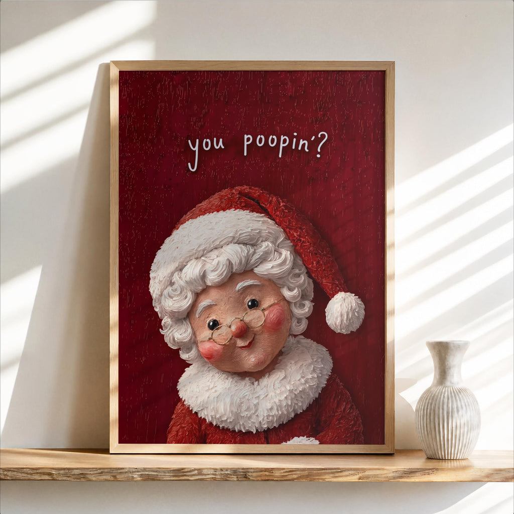 Framed vintage Mrs Claus print with red textured backdrop, rosy cheeks and glasses, funny Christmas bathroom wall art