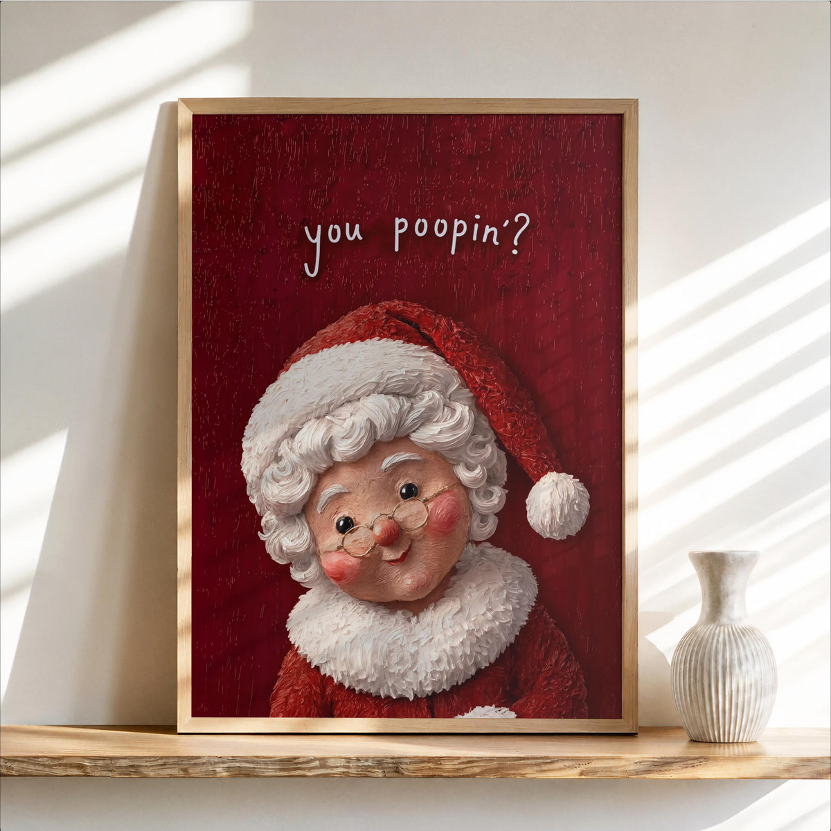 Framed vintage Mrs Claus print with red textured backdrop, rosy cheeks and glasses, funny Christmas bathroom wall art