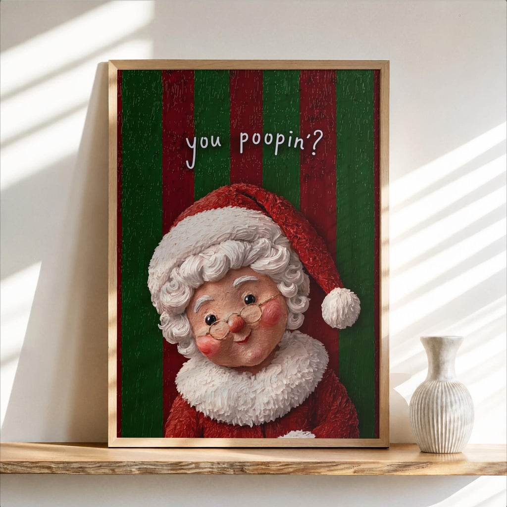 Framed Mrs Claus print on shelf, green textured background, cheeky 'You poopin?' text, funny Christmas bathroom wall art