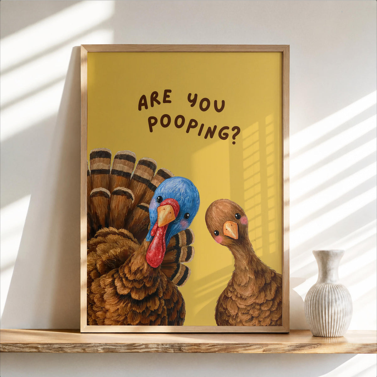 Framed funny turkey bathroom print on golden yellow background, warm autumn bathroom decor feel with two whimsical turkeys