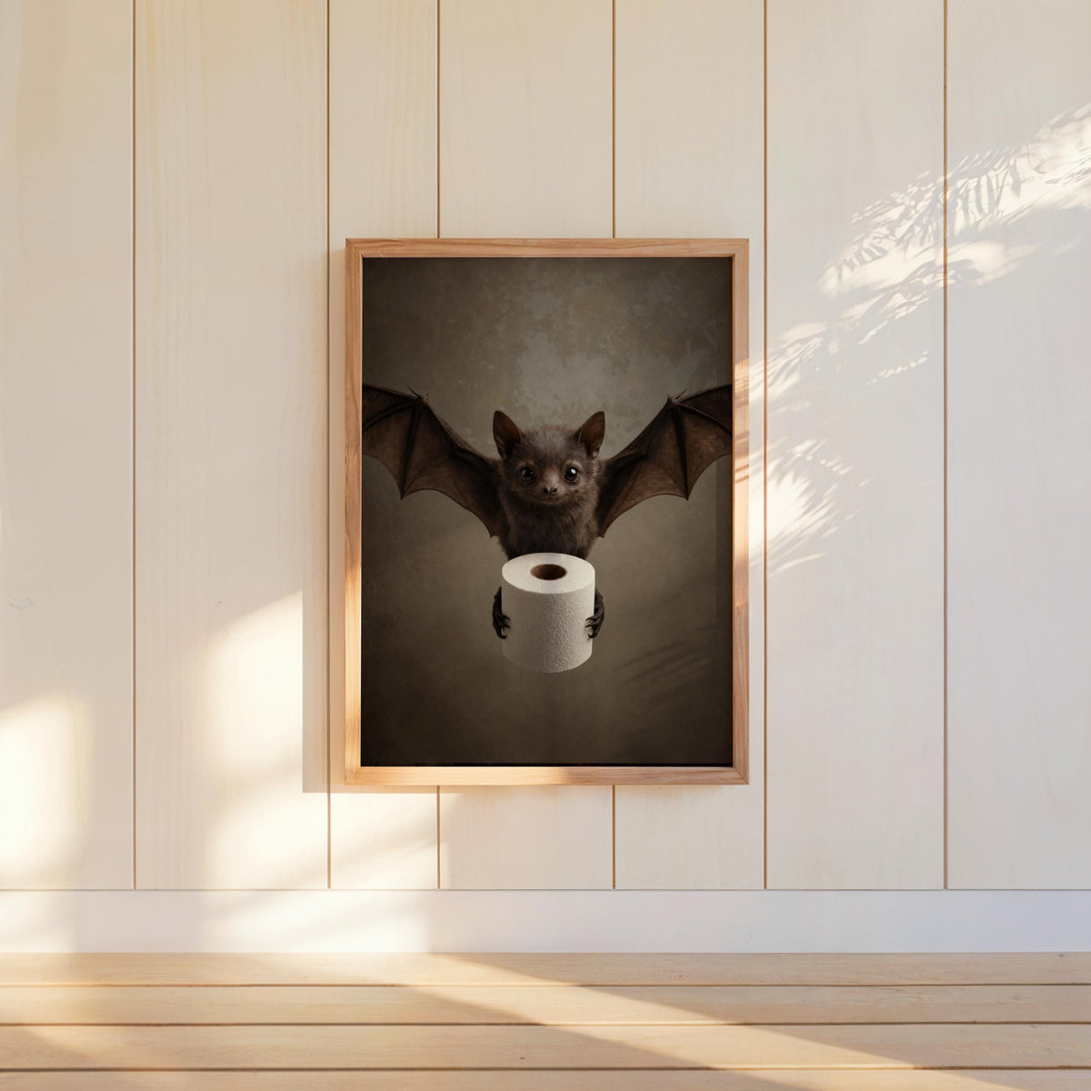 Hanging portrait print on paneled wall, warm sunlight, moody neutrals and playful toilet humor, spooky bathroom wall decor
