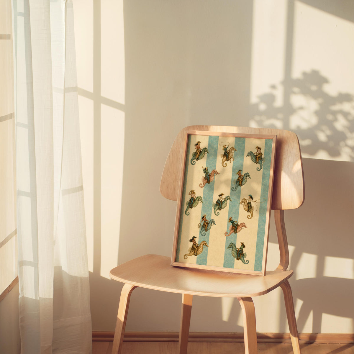 Sunlit mid-century chair holds the coastal cowgirl art print, lamp casting shadows on vintage seahorse stripes