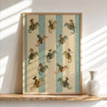 Framed coastal cowgirl wall art leaning on a wood shelf, repeating cowgirl-on-seahorse aqua stripes