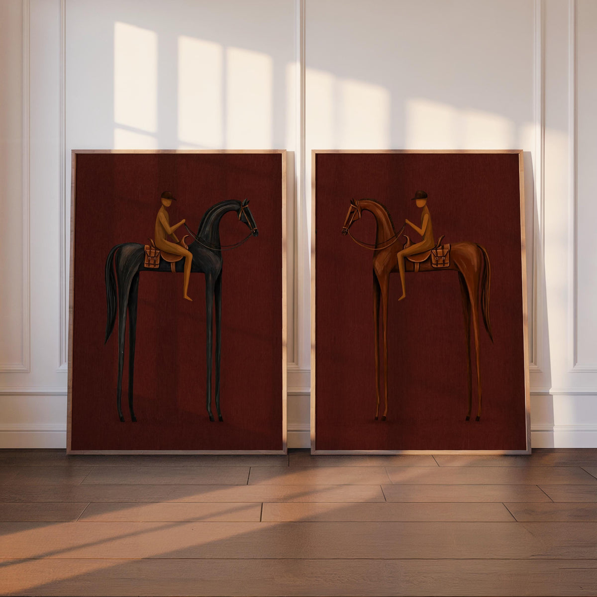 Two burgundy surreal horse wall art prints leaning on a white paneled wall, warm sunlight, mid century tone