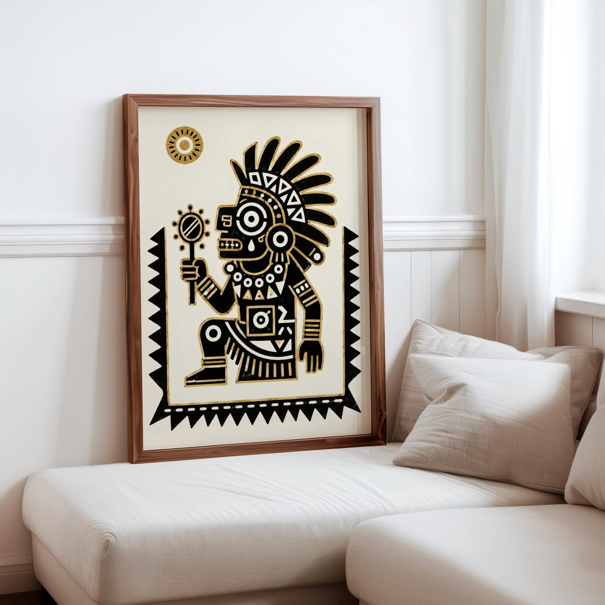 Framed Tezcatlipoca wall art centered above sofa, cream background and geometric Mesoamerican motifs