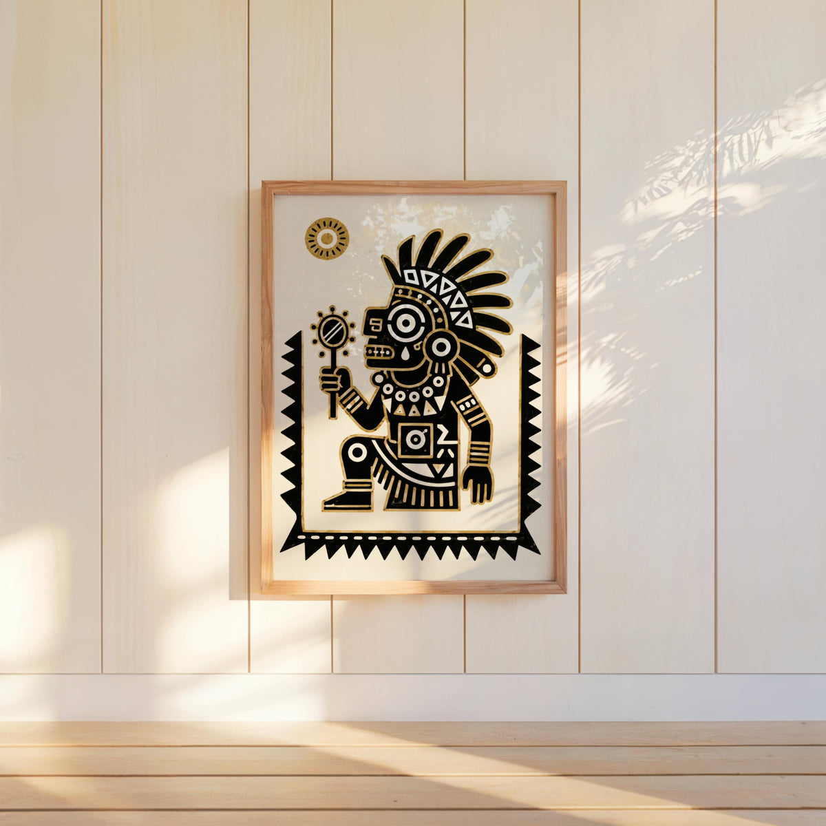 Tezcatlipoca wall art hung on paneled wall, bold feathered headdress, black and gold contrast