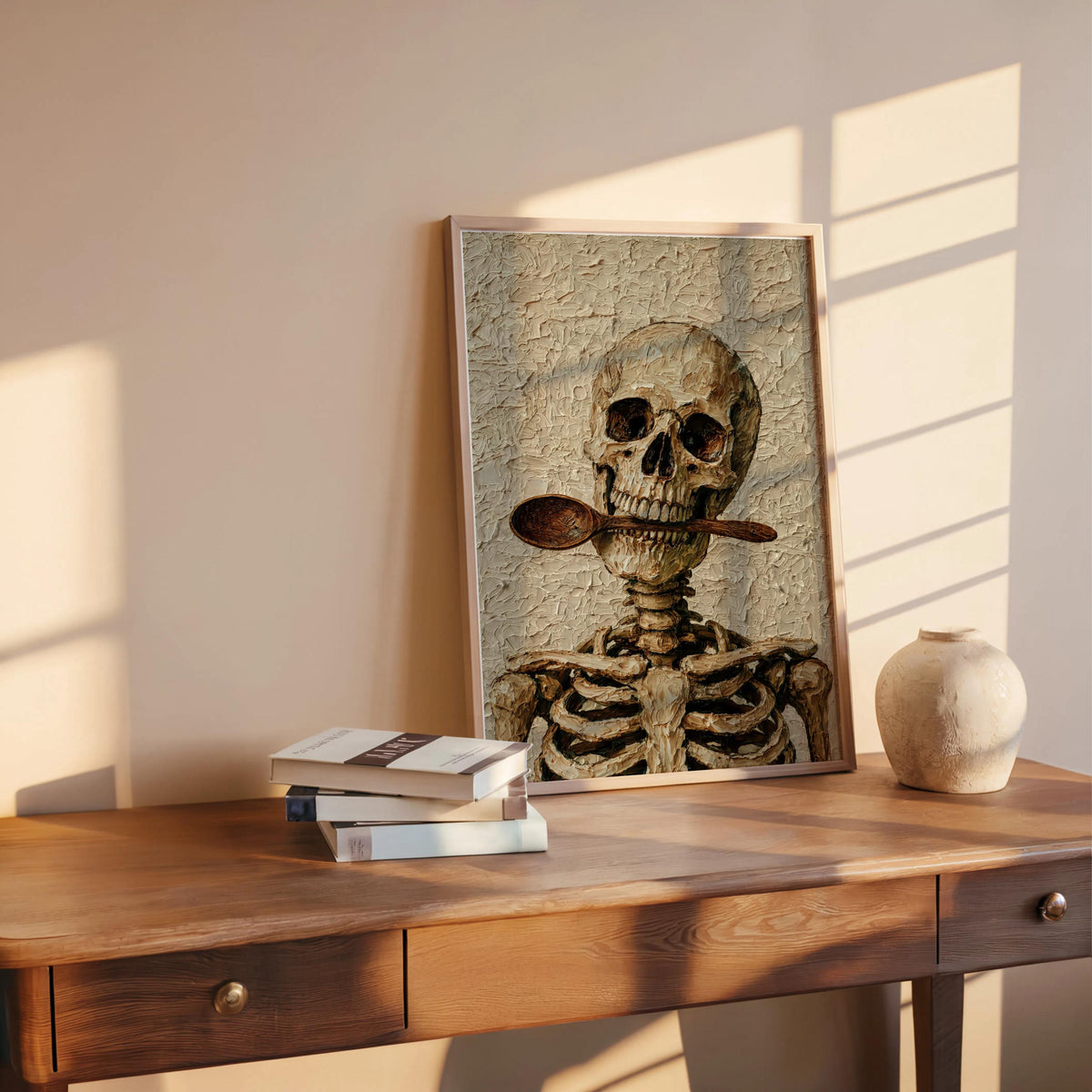 Sunlit desk display, creepy cute skeleton chef wall art leaning with books and a ceramic orb, rustic kitchen mood.