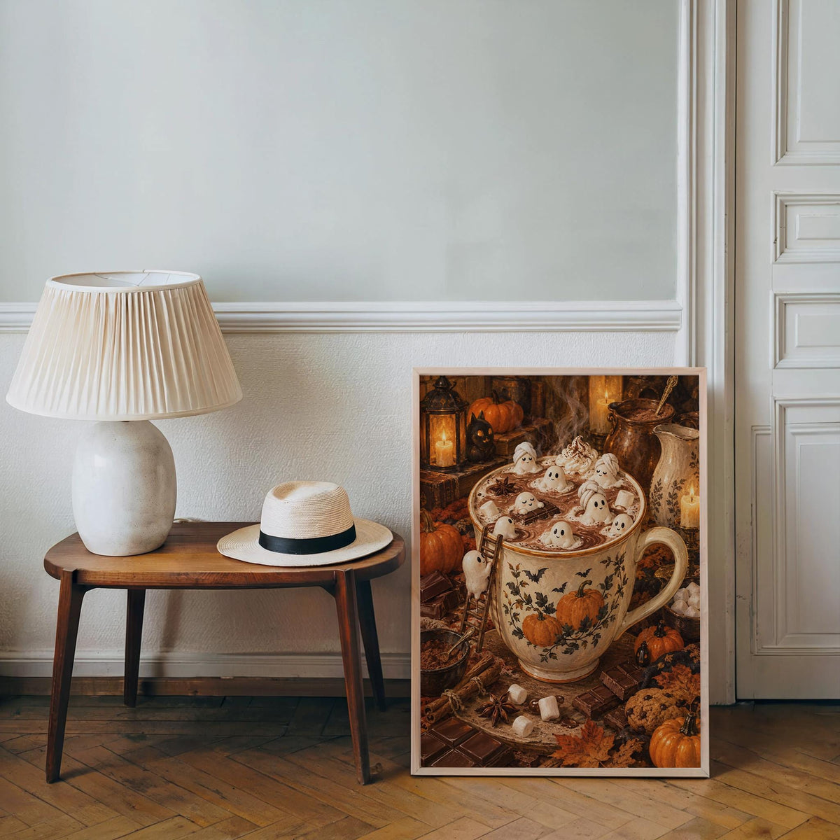 Halloween tiny people print propped on floor by a lamp and table, tiny people art print in cozy living room setting