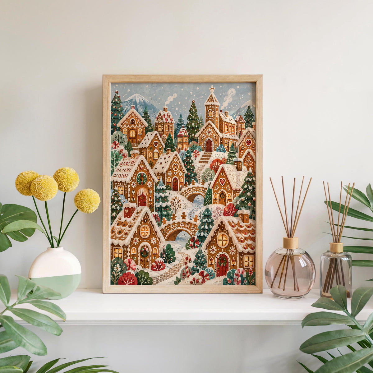 Gingerbread Christmas village print centered above a windowsill with potted plants