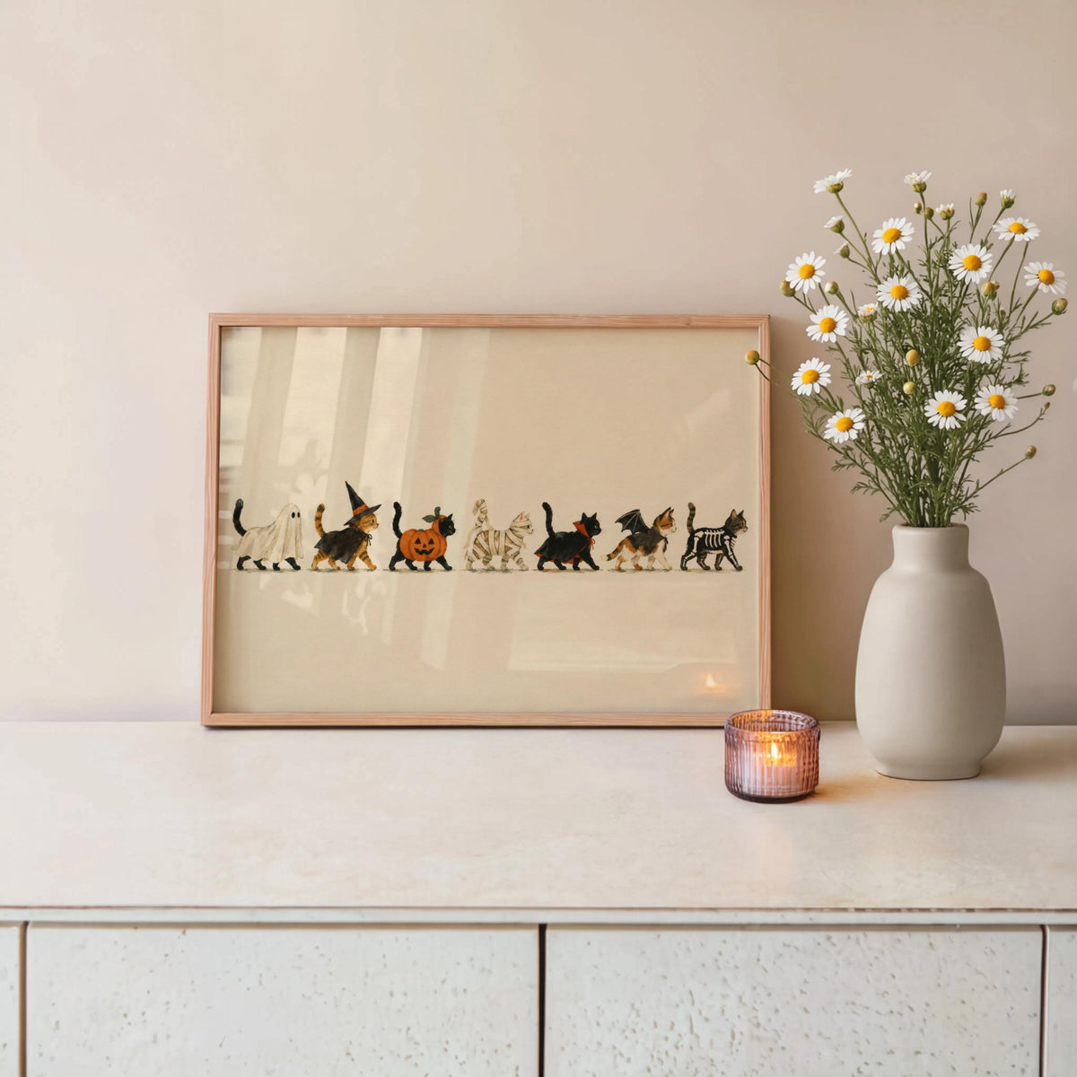 Small framed Halloween cat wall art on mantel, muted autumnal palette, spooky yet charming.