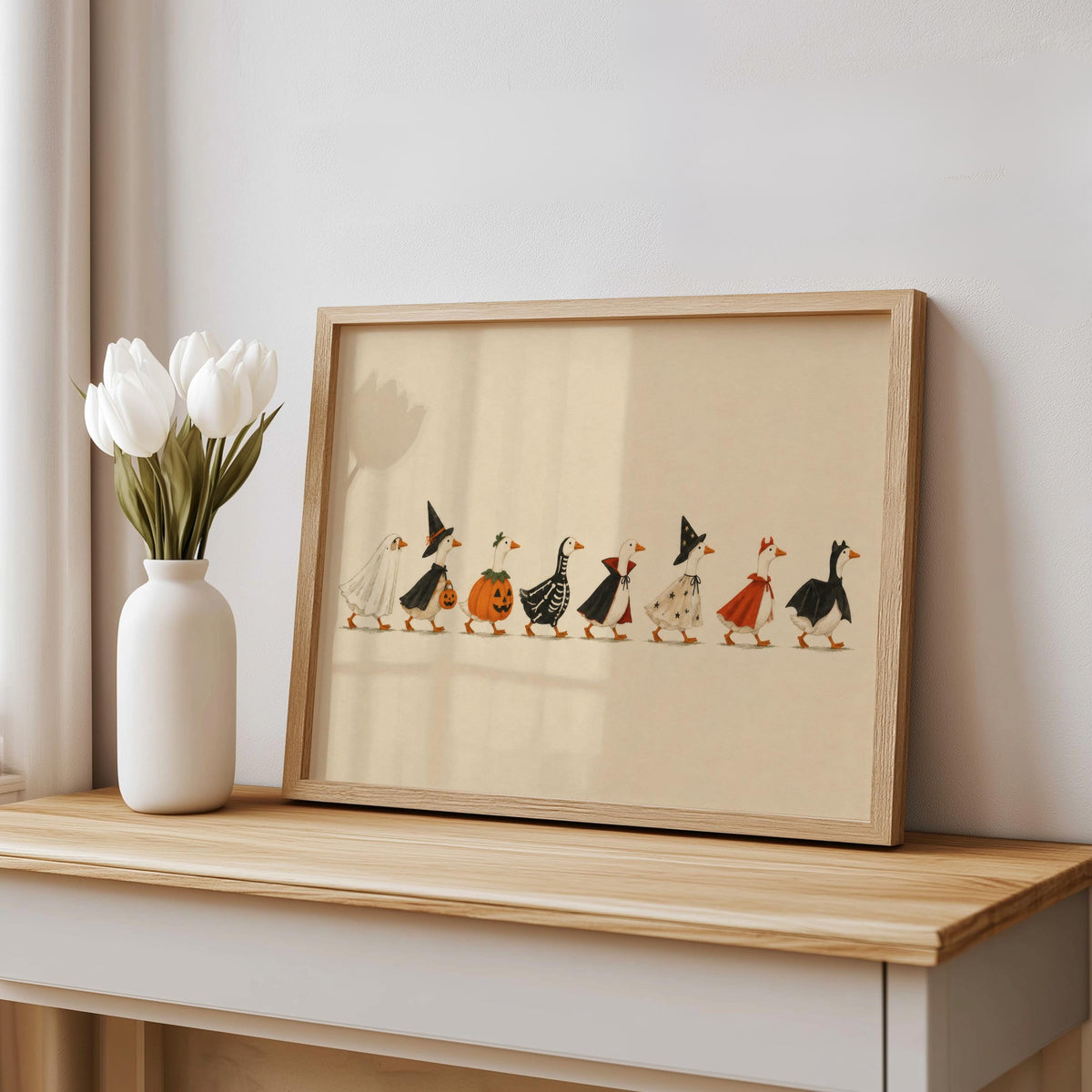 Unframed Halloween duck print casually propped on shelf with tulips, rustic Halloween kitchen wall art charm