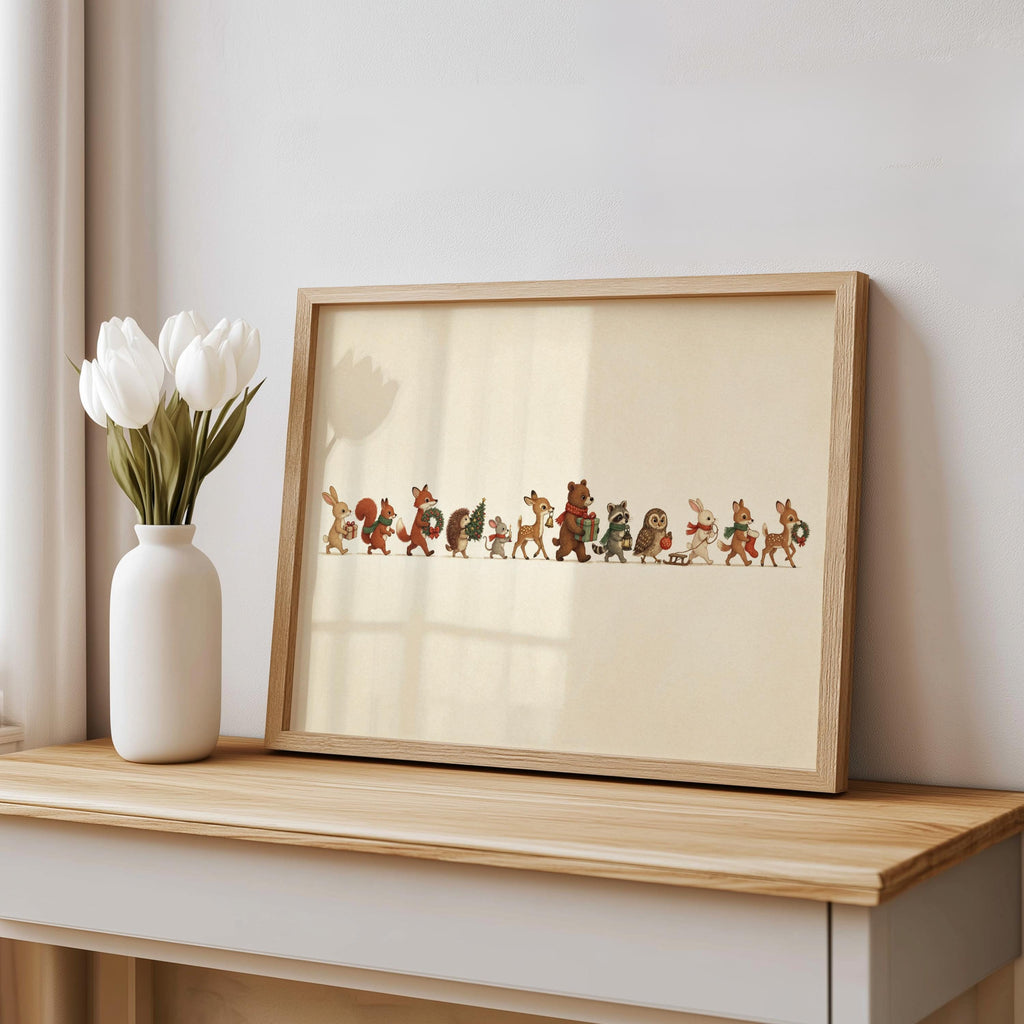 Console table scene with vase, framed Christmas woodland animals print, muted earthy tones and rustic frame