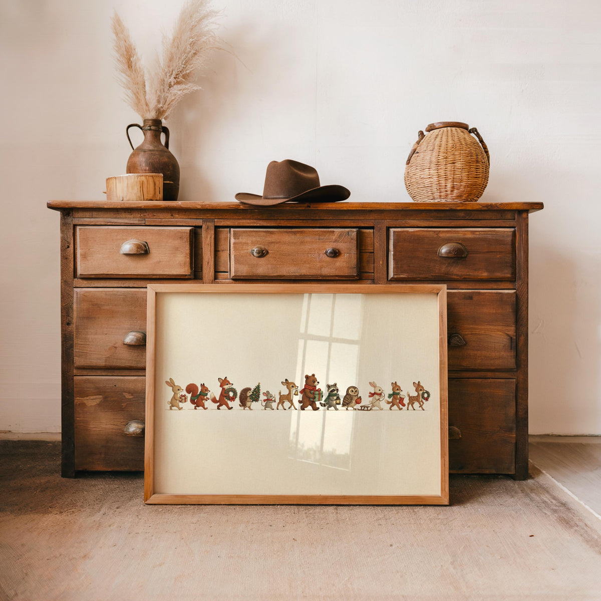 Rustic dresser display, framed Christmas woodland animals print, vintage storybook style, cozy warm hues