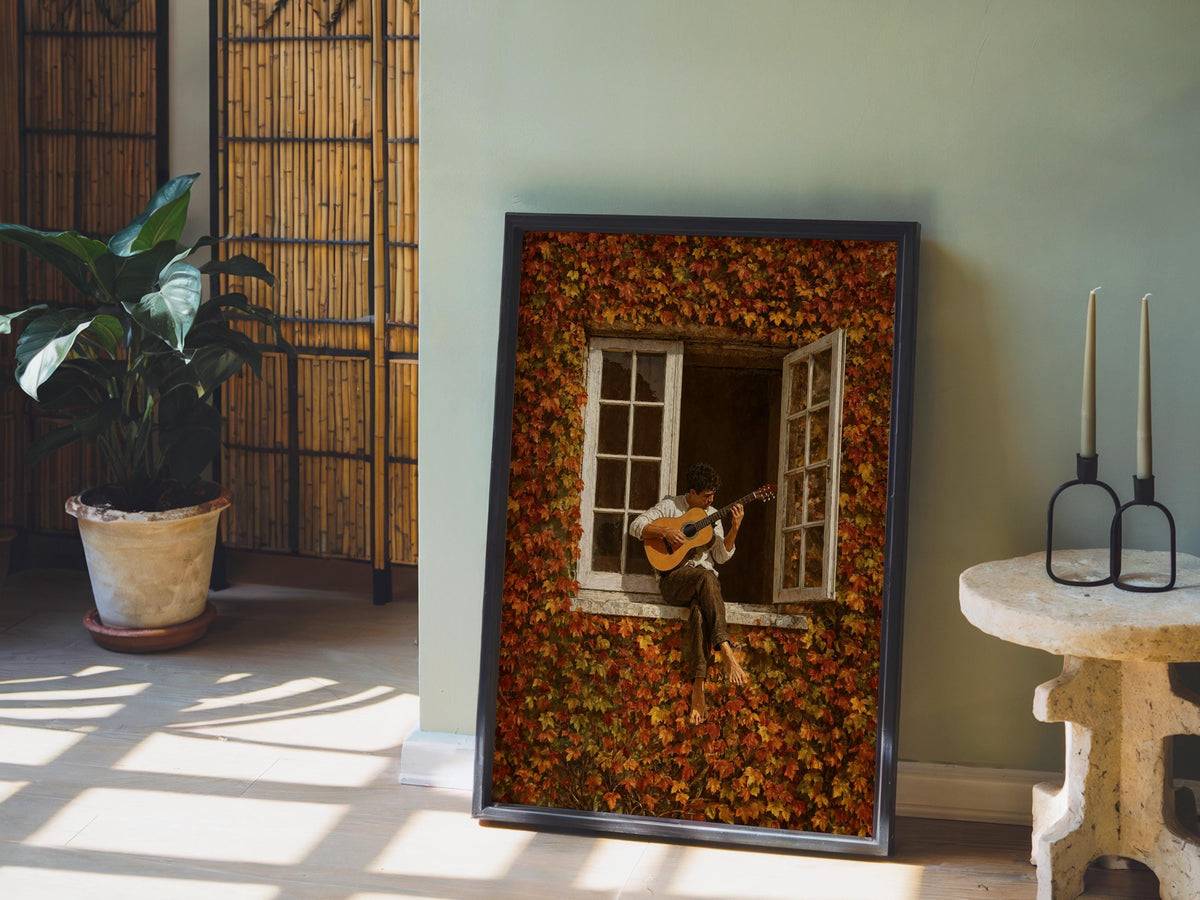 Framed autumn guitarist wall art leaning by a potted plant, warm sunlight across hardwood, rustic guitar art styling.
