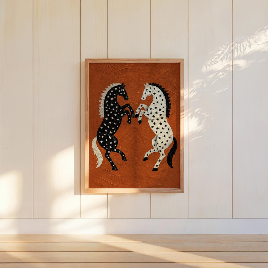 Hanging rearing horse wall decor on pale vertical planks, sunlit room, textured rust orange western art with contrasting star-patterned horses
