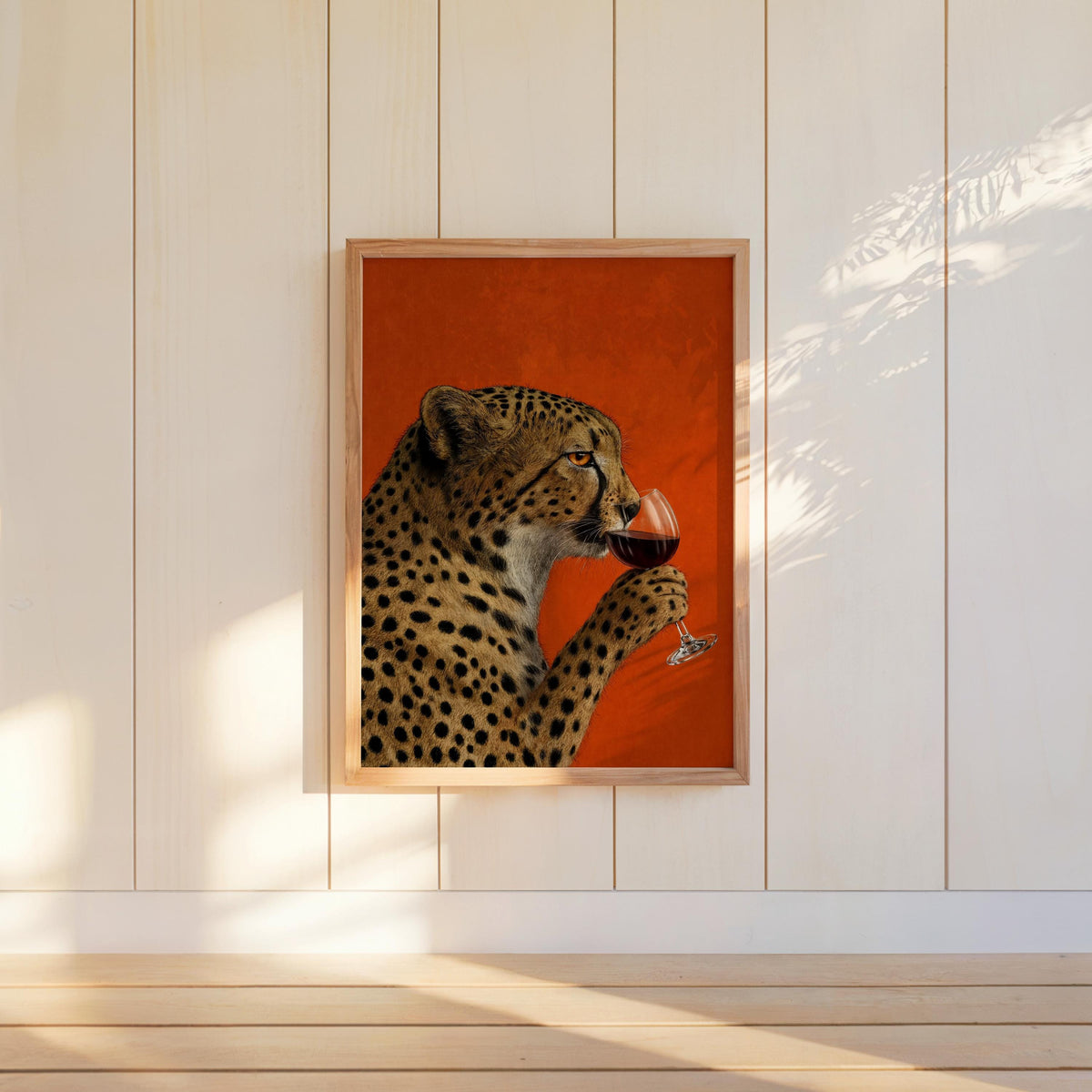 Cheetah drinking wine wall art hung on pale vertical panels, strong burnt-orange color, maximalist red wall art energy