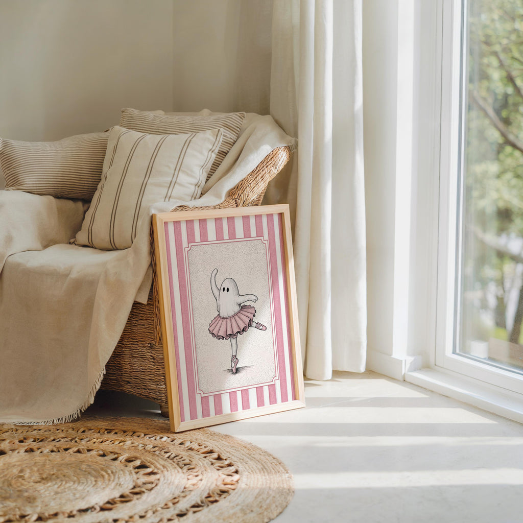 Small framed ballerina ghost poster tucked by a cozy chair and blanket, cute ghost poster for nurseries