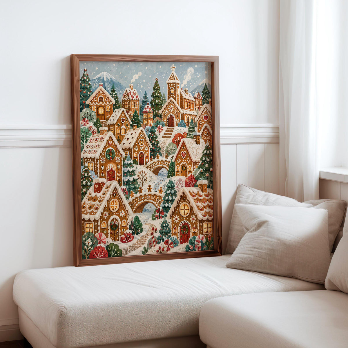 Gingerbread Christmas village print tucked against sofa cushions, relaxed holiday vibe