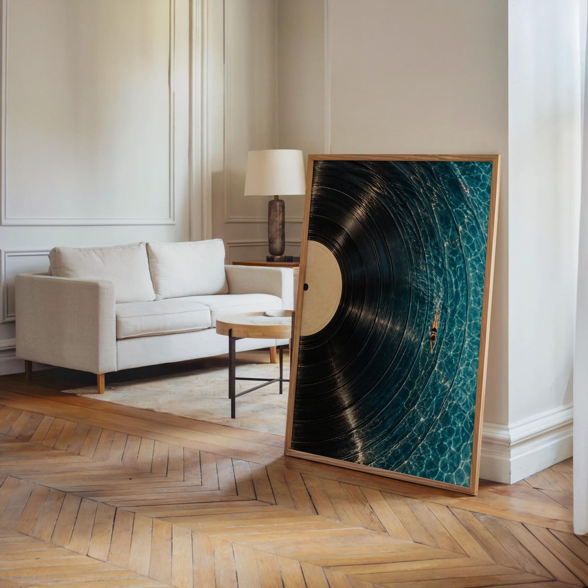 Large framed vinyl record wall art leaning in an airy living room, poollike grooves complement neutral decor