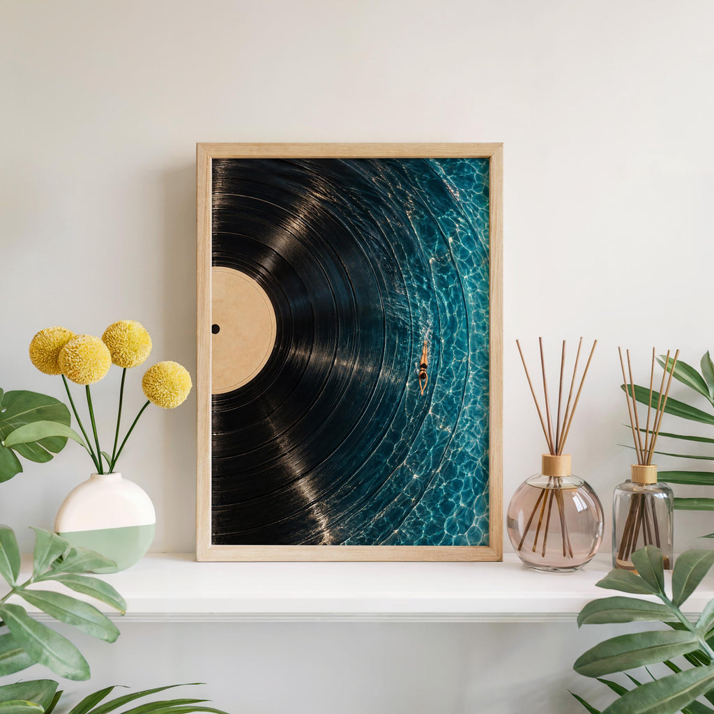 Framed vinyl record wall art on a low console with yellow blooms, music room decor vibe, rich blue palette