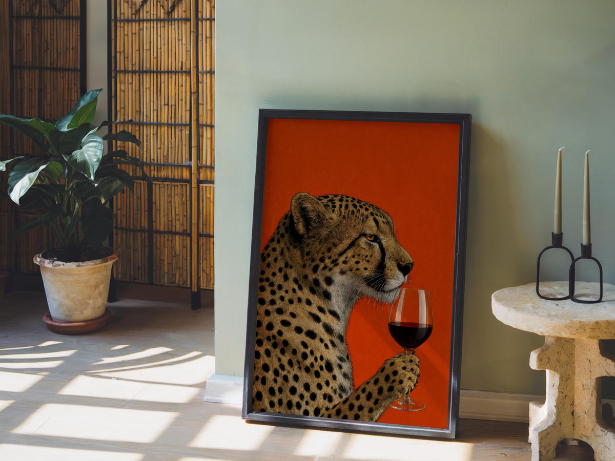 Cheetah wine wall art propped on the floor near a potted plant and wicker stool, warm sunlight spill.