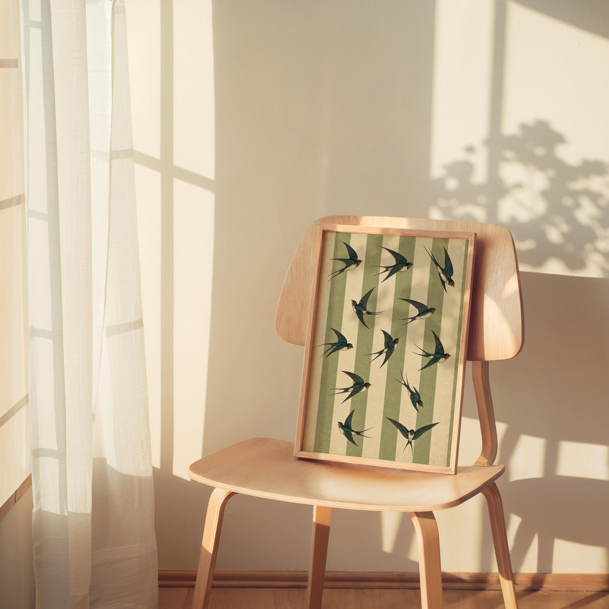 Swallow bird print seated on a wooden chair by a sunlit window, retro bird poster mood for cozy interiors