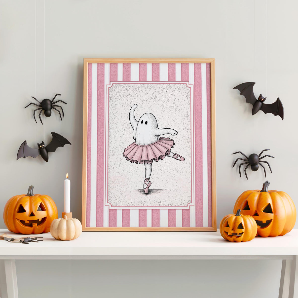 Framed ballerina ghost poster between jack-o-lanterns and bats, playful Halloween nursery decor in pink