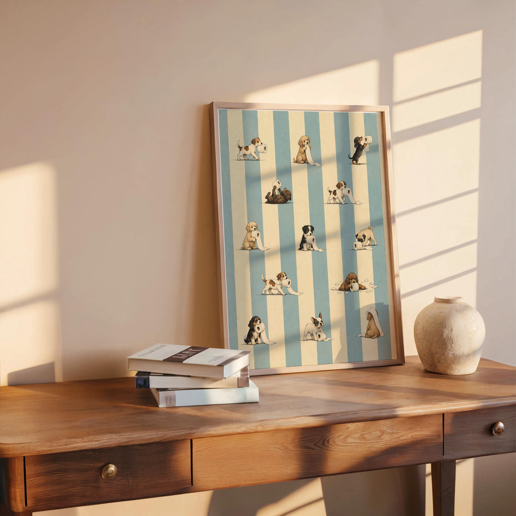 Print on a wooden desk with books and warm light, quirky dog wall decor with toilet paper puppies, funny dog bathroom wall art