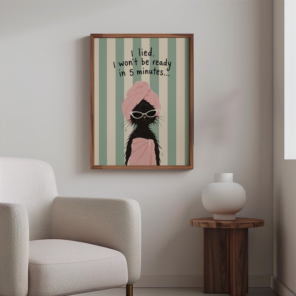 Framed funny bathroom wall decor above boucle chair, mint stripes and pink accents, minimalist vanity wall art
