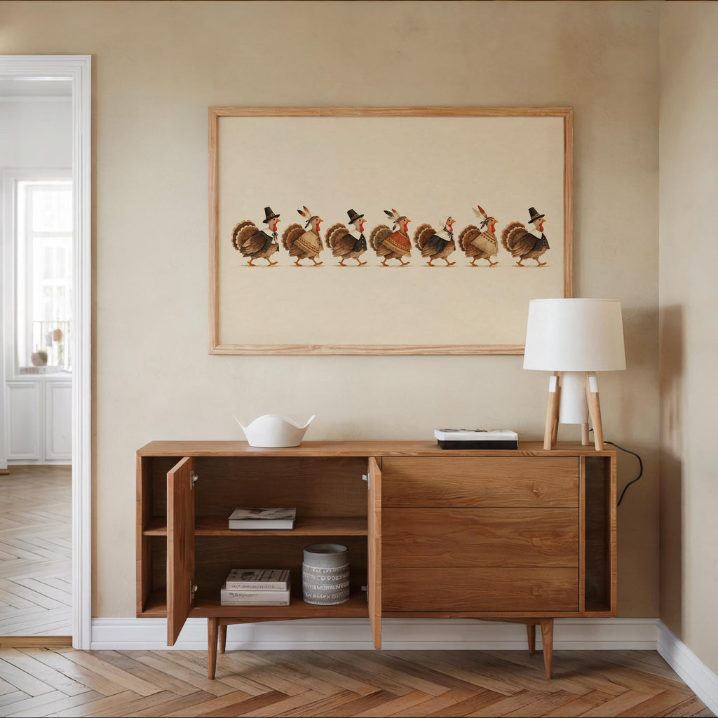 Midcentury sideboard topped with framed turkey parade wall art, muted rust and brown tones complement wood