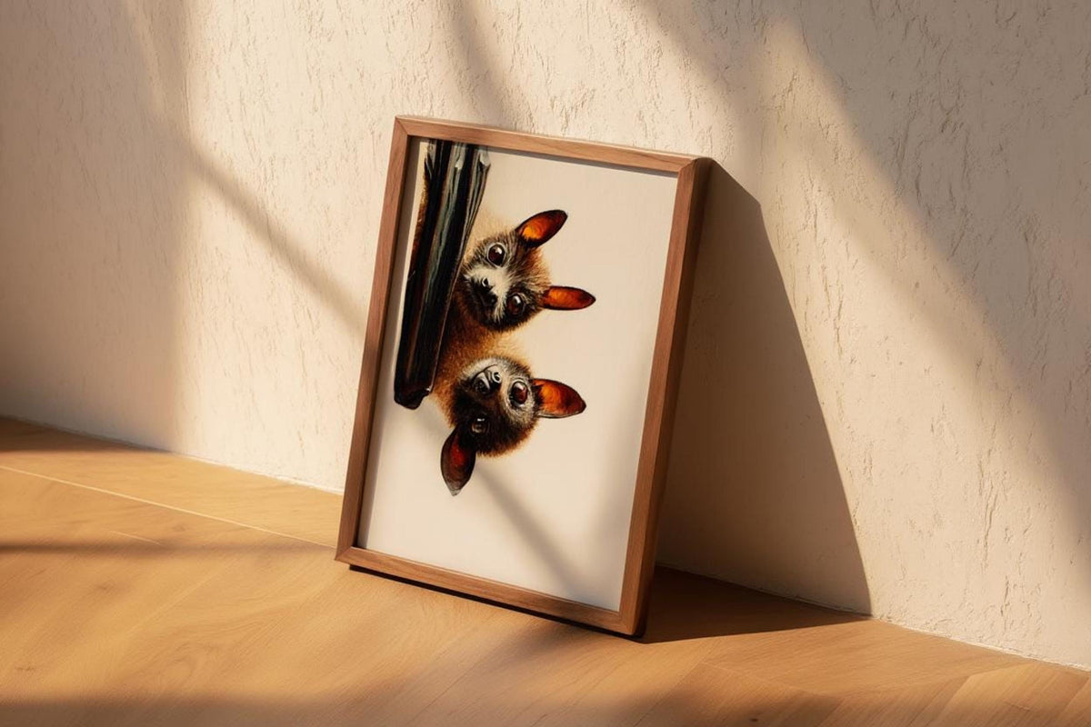 Angled bat portrait art print leaning against textured plaster, sunlight accentuating fur detail