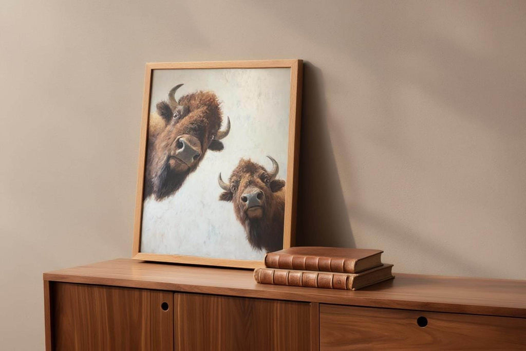 Bison wall art propped on wooden sideboard, warm light, neutral animal wall art styling