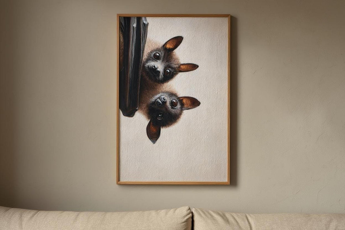 Tall framed bat portrait art mounted above a sofa, simple neutral room, whimsical gothic animal print