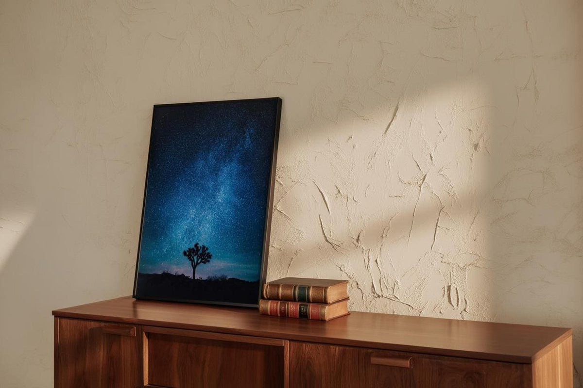 Angled Joshua Tree Milky Way wall art leaning on wood cabinet, blue galaxy wall art with textured wall shadows